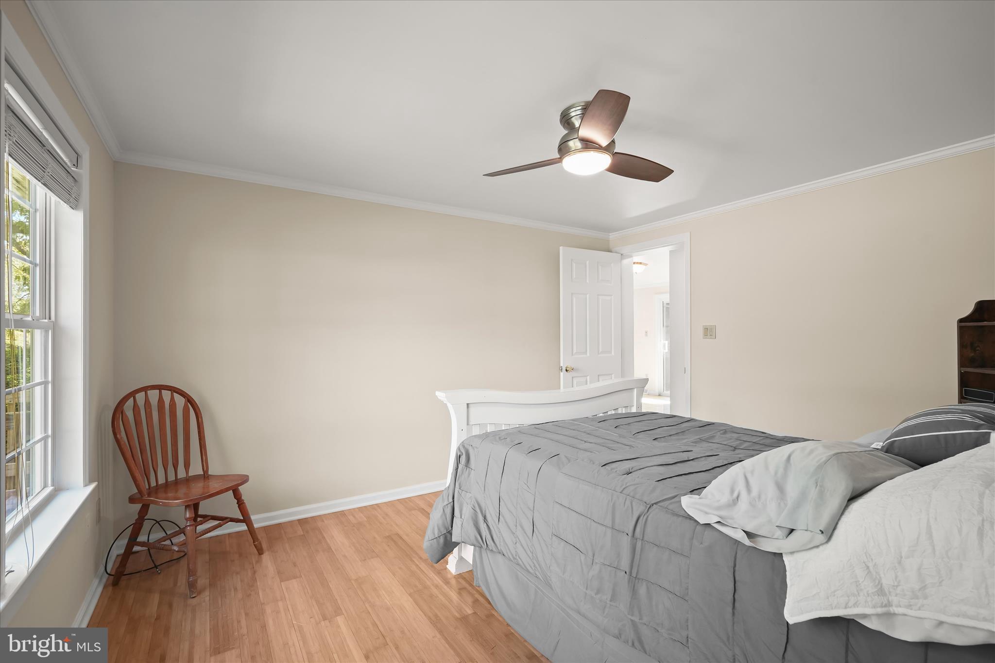 3325 Allday Road Huntingtown, MD 20639 - Photo 30 of 77 a bedroom with a bed and a chair