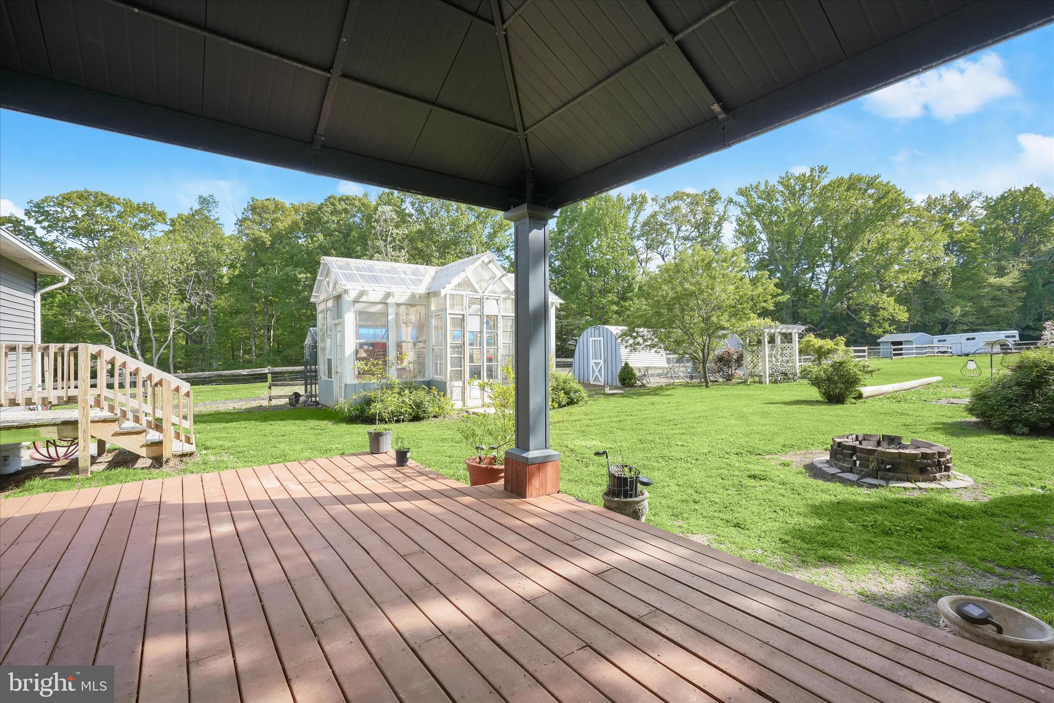 3325 Allday Road Huntingtown, MD 20639 - Photo 34 of 77 a view of a house with backyard and a patio