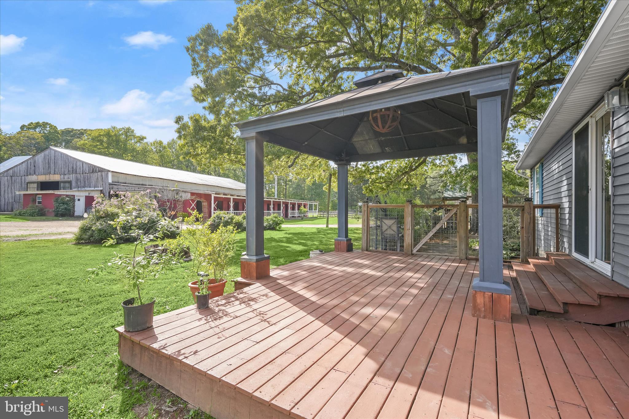 3325 Allday Road Huntingtown, MD 20639 - Photo 36 of 77 a view of backyard with a deck and wooden floor