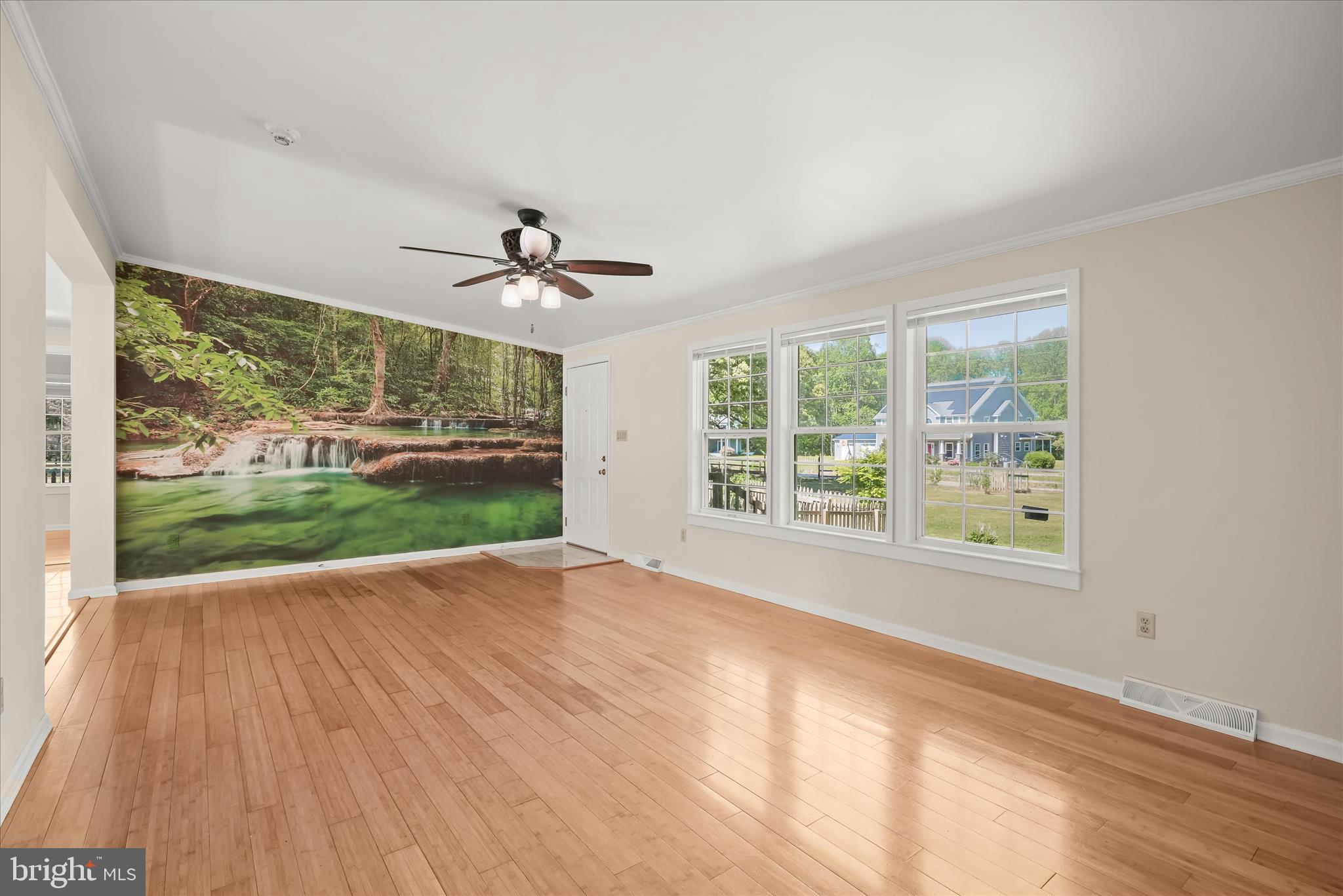 3325 Allday Road Huntingtown, MD 20639 - Photo 10 of 77 a view of an empty room with a window and wooden floor