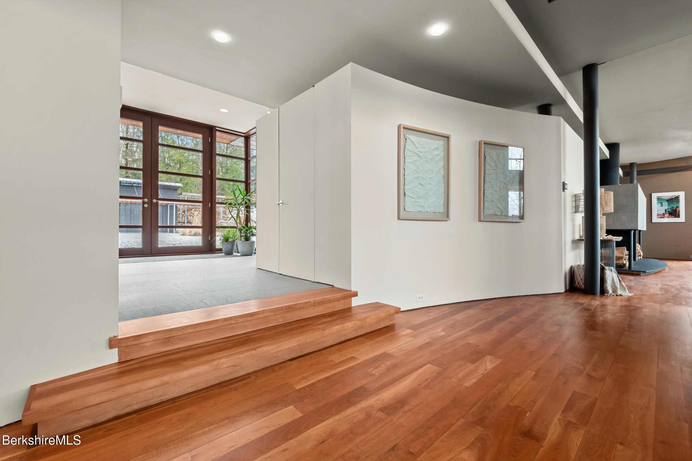 250 Long Pond Road Great Barrington, MA 01230 - Photo 40 of 56 a view of an empty room with wooden floor and a window