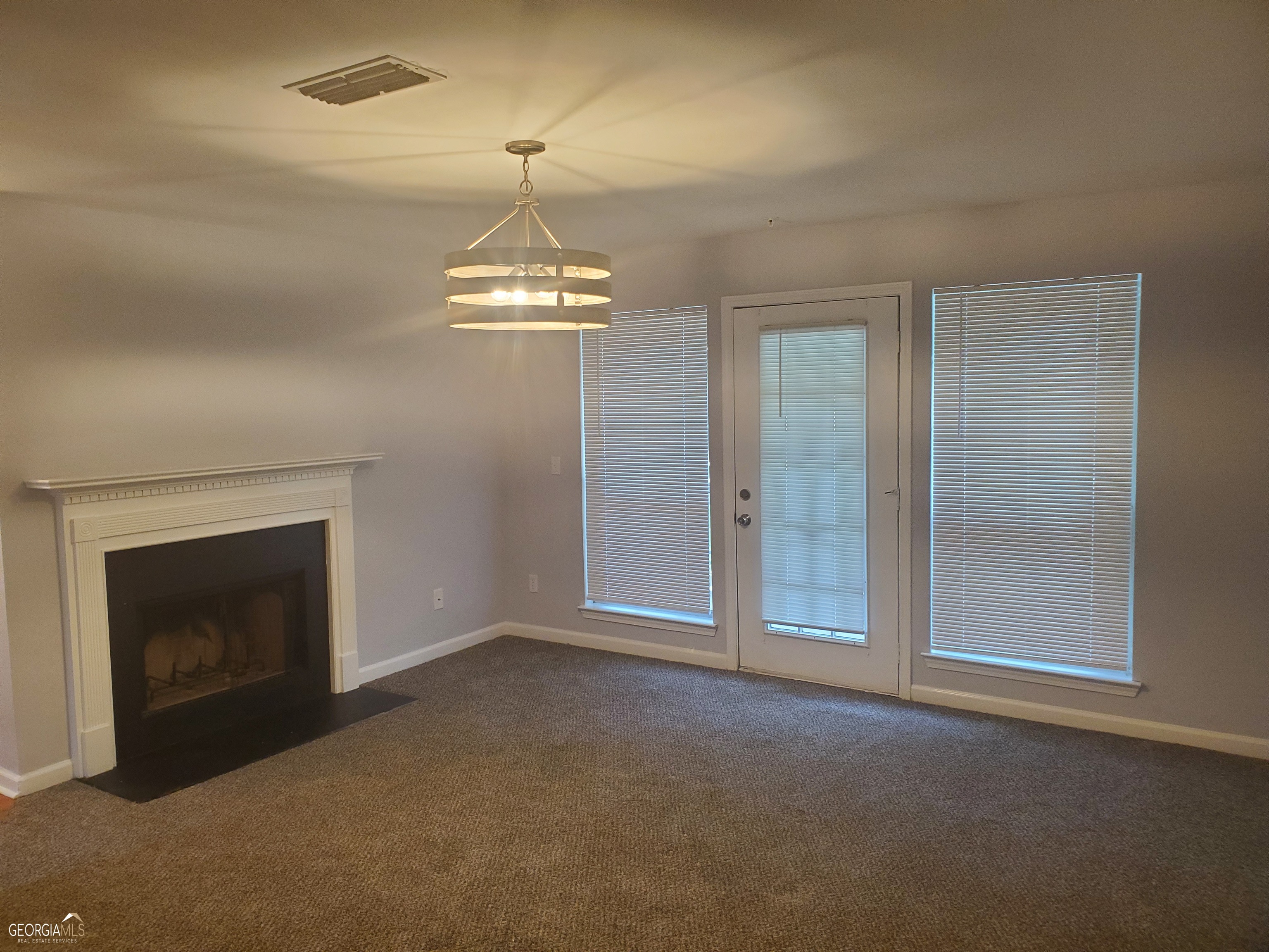 3608 Shepherds Path Decatur, GA 30034 - Photo 4 of 15 an empty room with a fireplace