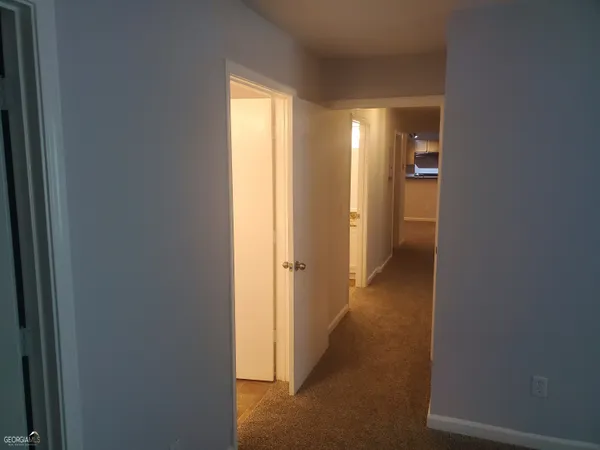 a view of a room with a hallway