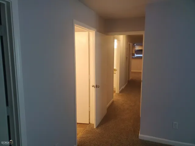 a view of a room with a hallway