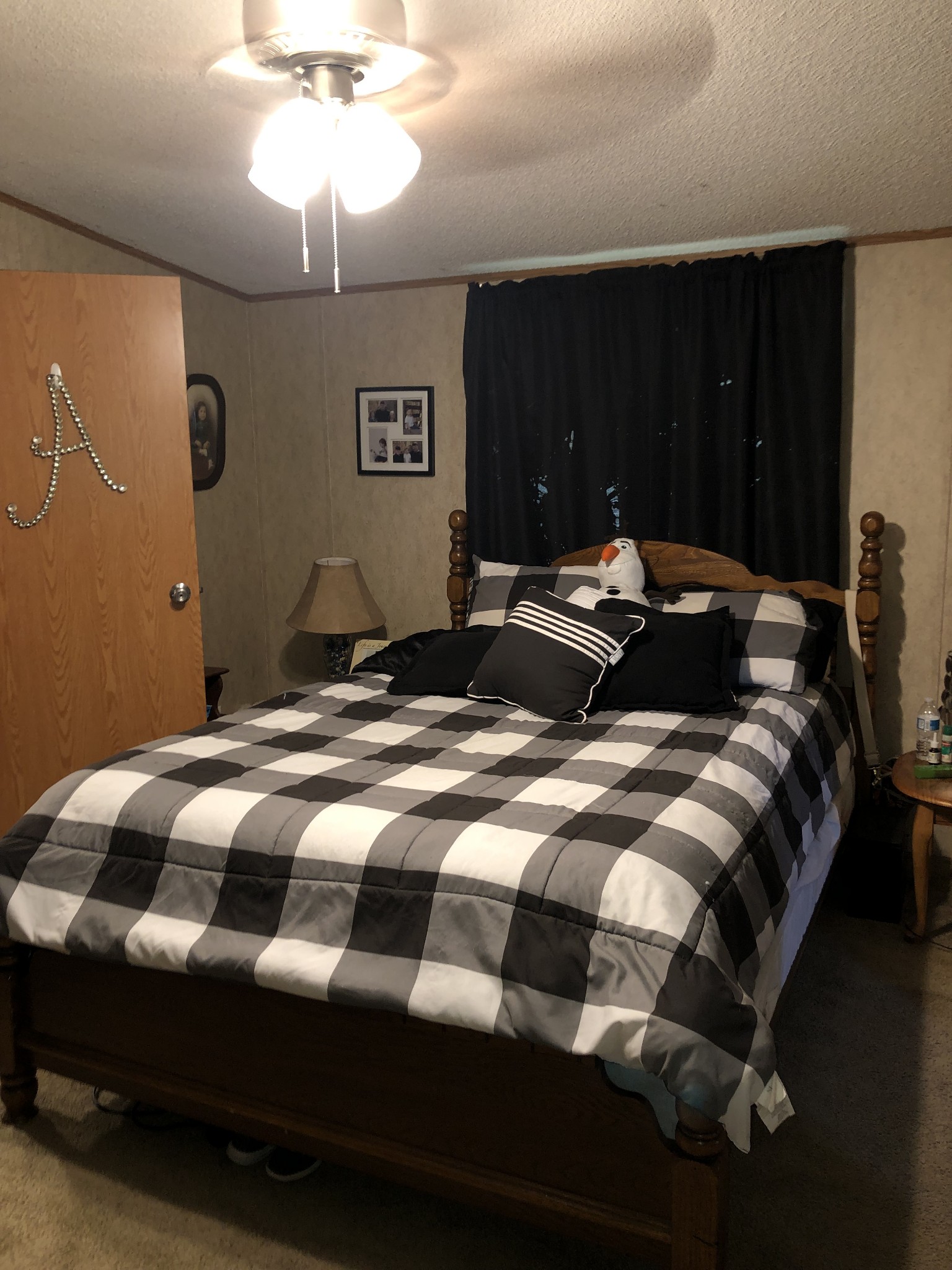 410 Fort Blount Road Hartsville, TN 37074 - Photo 5 of 8 a bedroom with a bed and a chandelier
