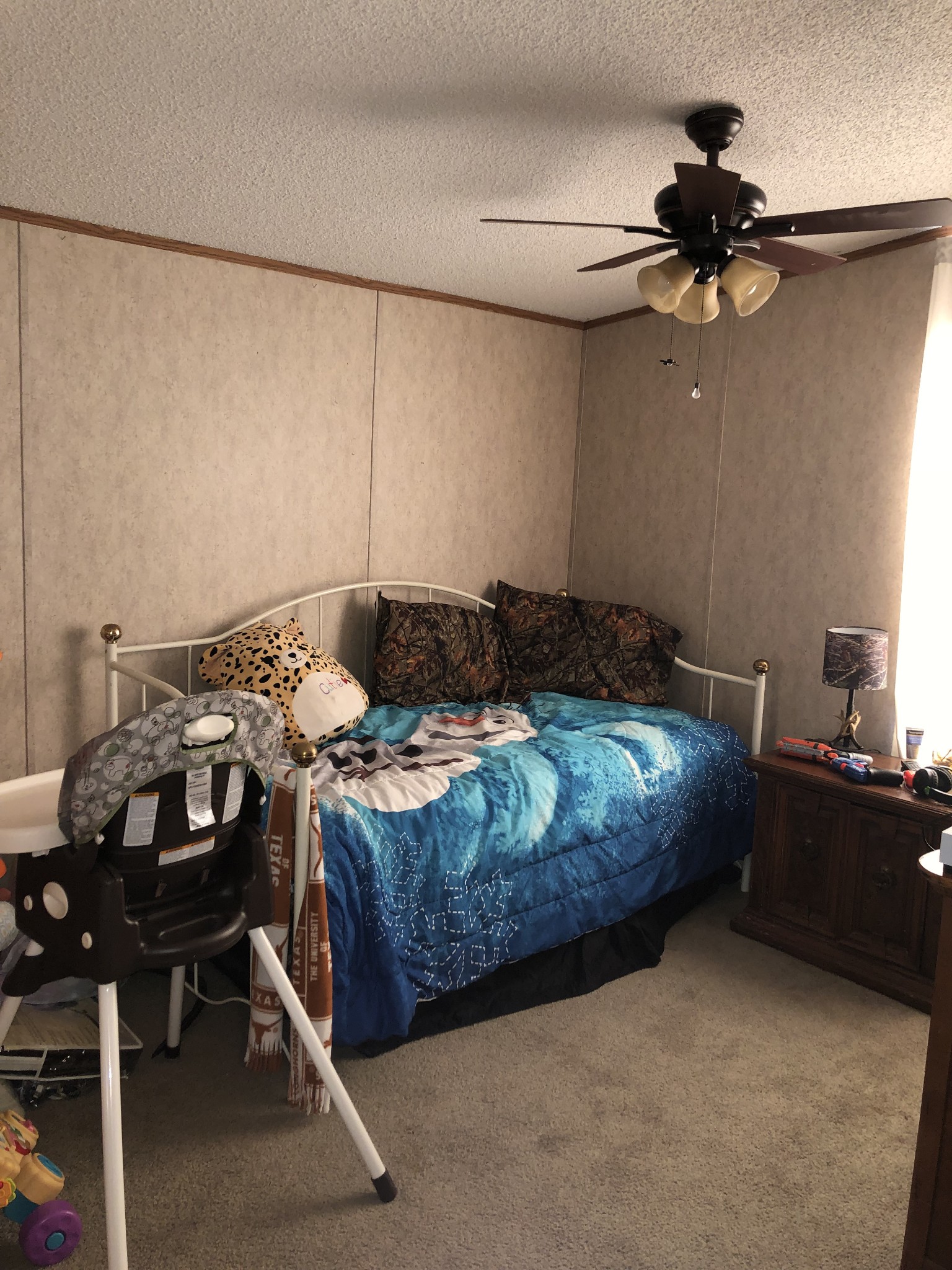 410 Fort Blount Road Hartsville, TN 37074 - Photo 7 of 8 a bedroom with a bed and a chandelier