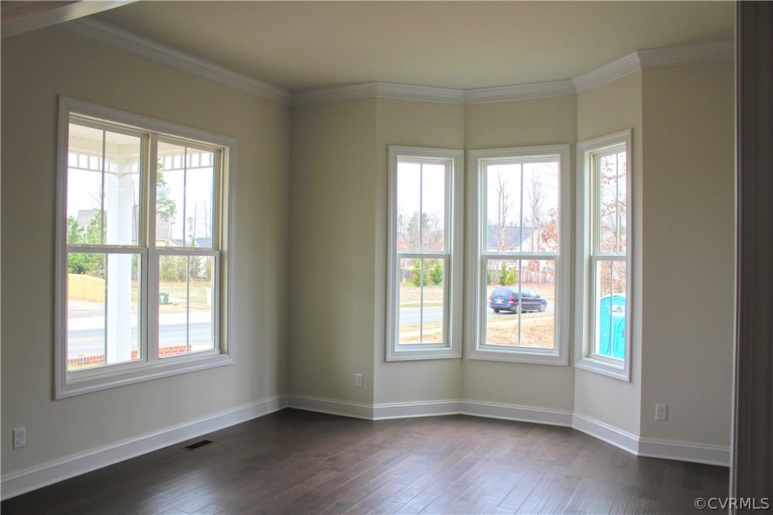 1413 Winterfield Road Midlothian, VA 23113 - Photo 2 of 33 a view of an empty room with wooden floor and a window