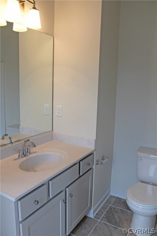 1413 Winterfield Road Midlothian, VA 23113 - Photo 23 of 33 a bathroom with a sink toilet and vanity