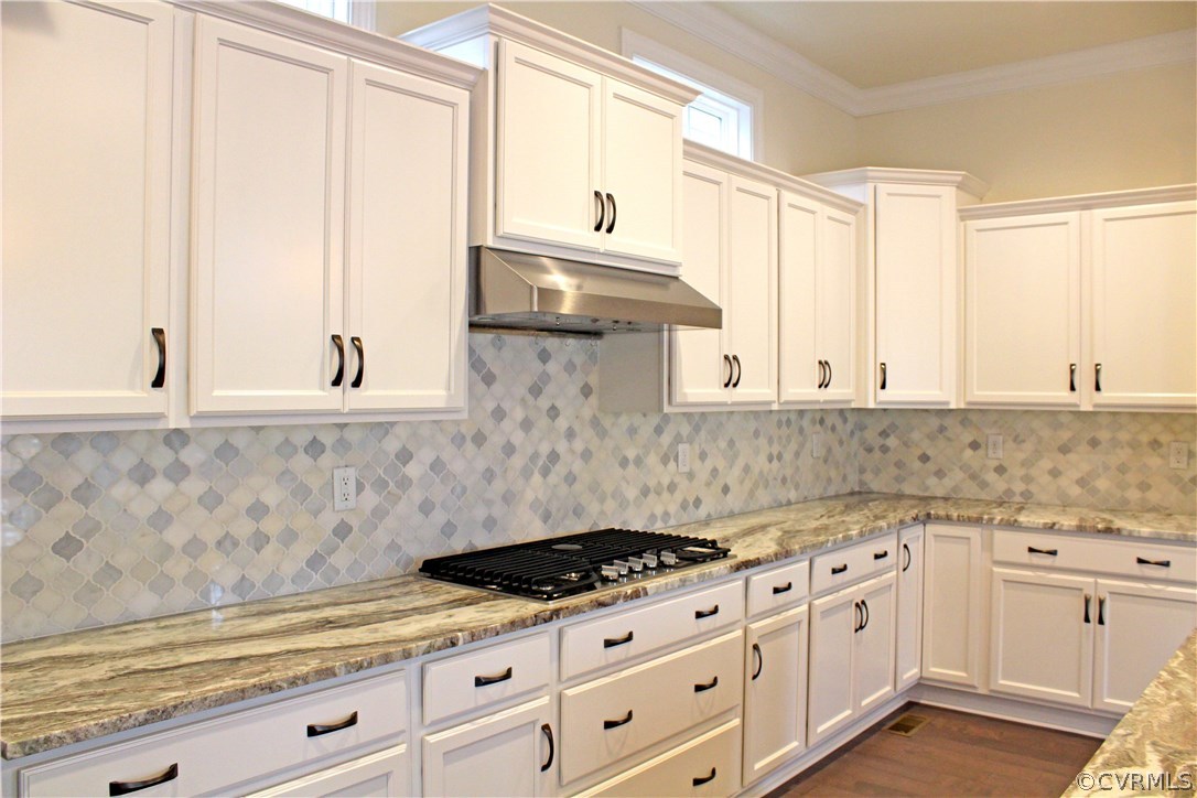 1413 Winterfield Road Midlothian, VA 23113 - Photo 9 of 33 a kitchen with granite countertop white cabinets and white appliances