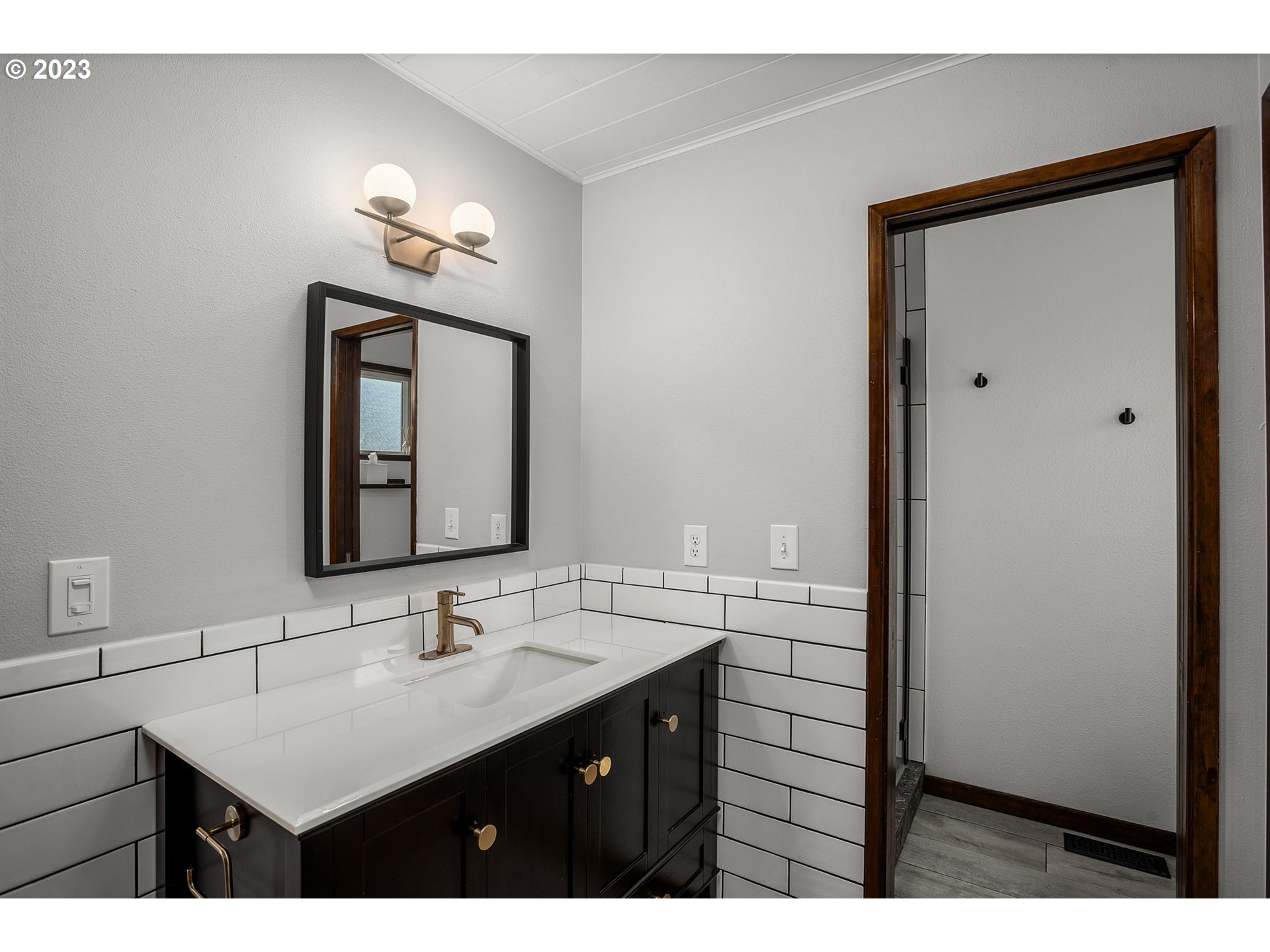 14155 Southwest Hart Road Beaverton, OR 97008 - Photo 11 of 30 a bathroom with a sink vanity and a mirror