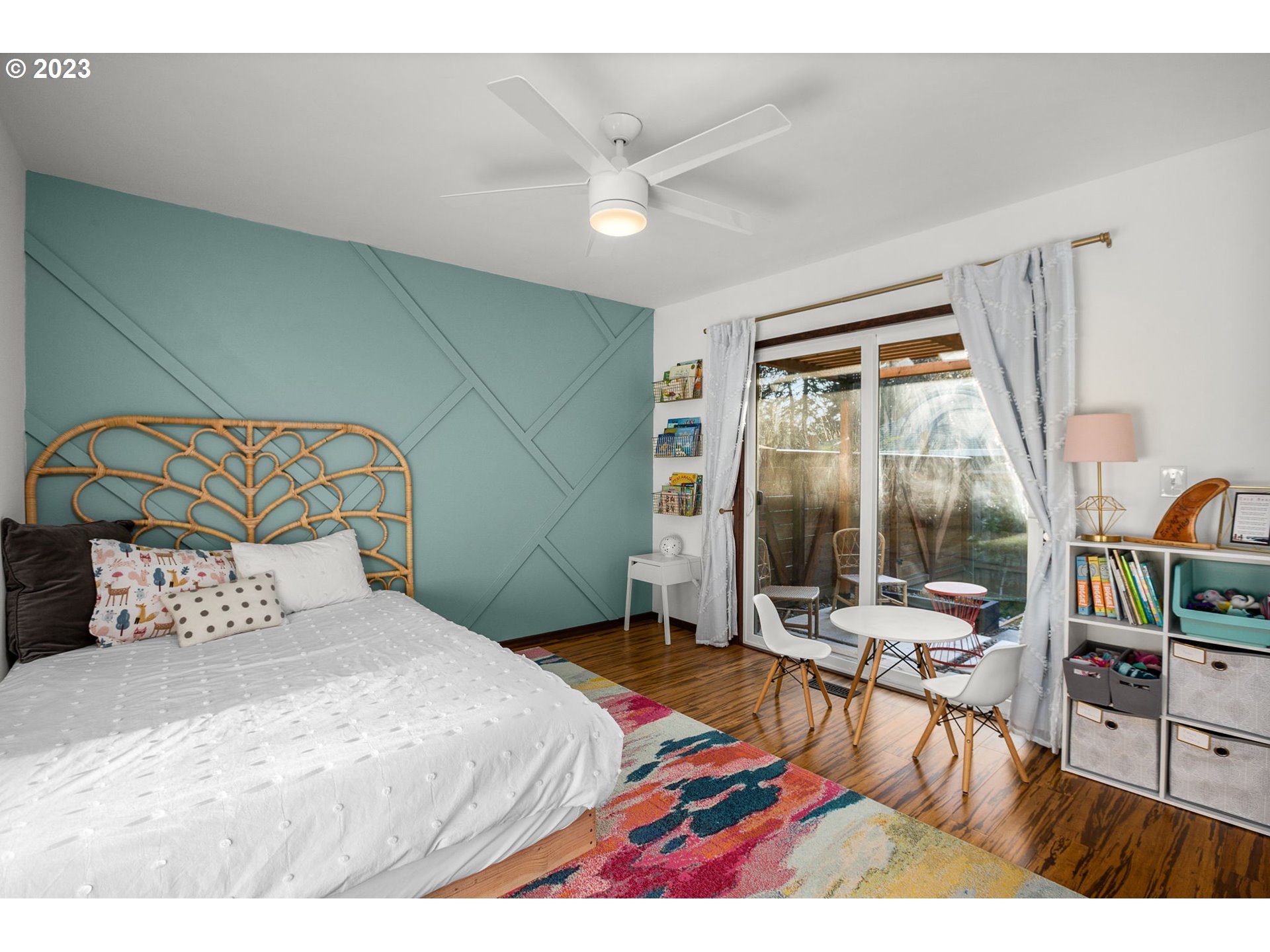 14155 Southwest Hart Road Beaverton, OR 97008 - Photo 12 of 30 a bedroom with a bed a large window with table and chairs