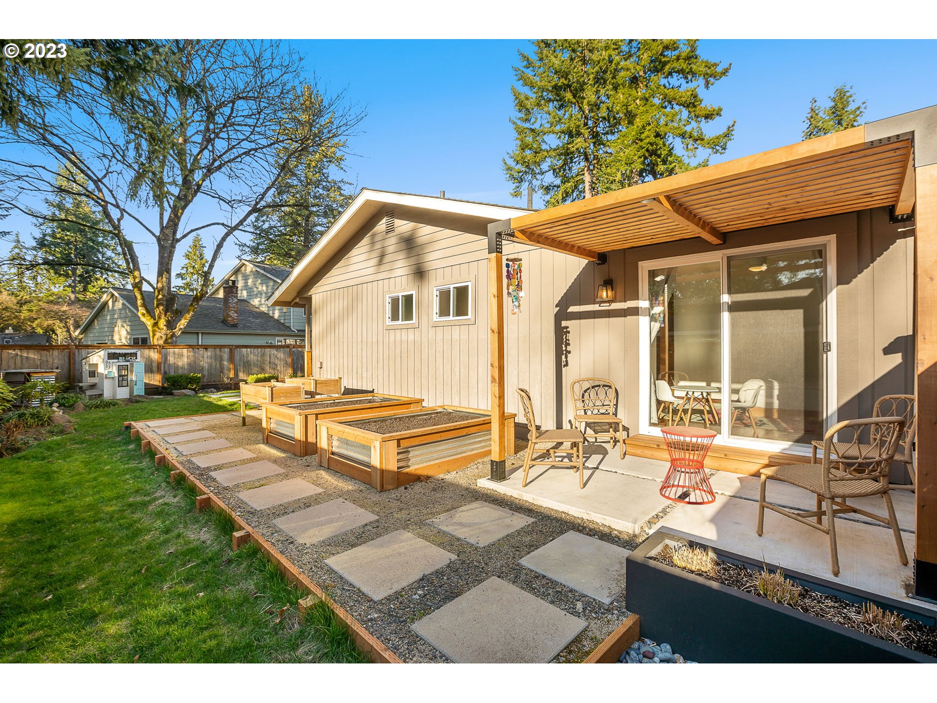 14155 Southwest Hart Road Beaverton, OR 97008 - Photo 16 of 30 a view of a house with backyard porch and sitting area
