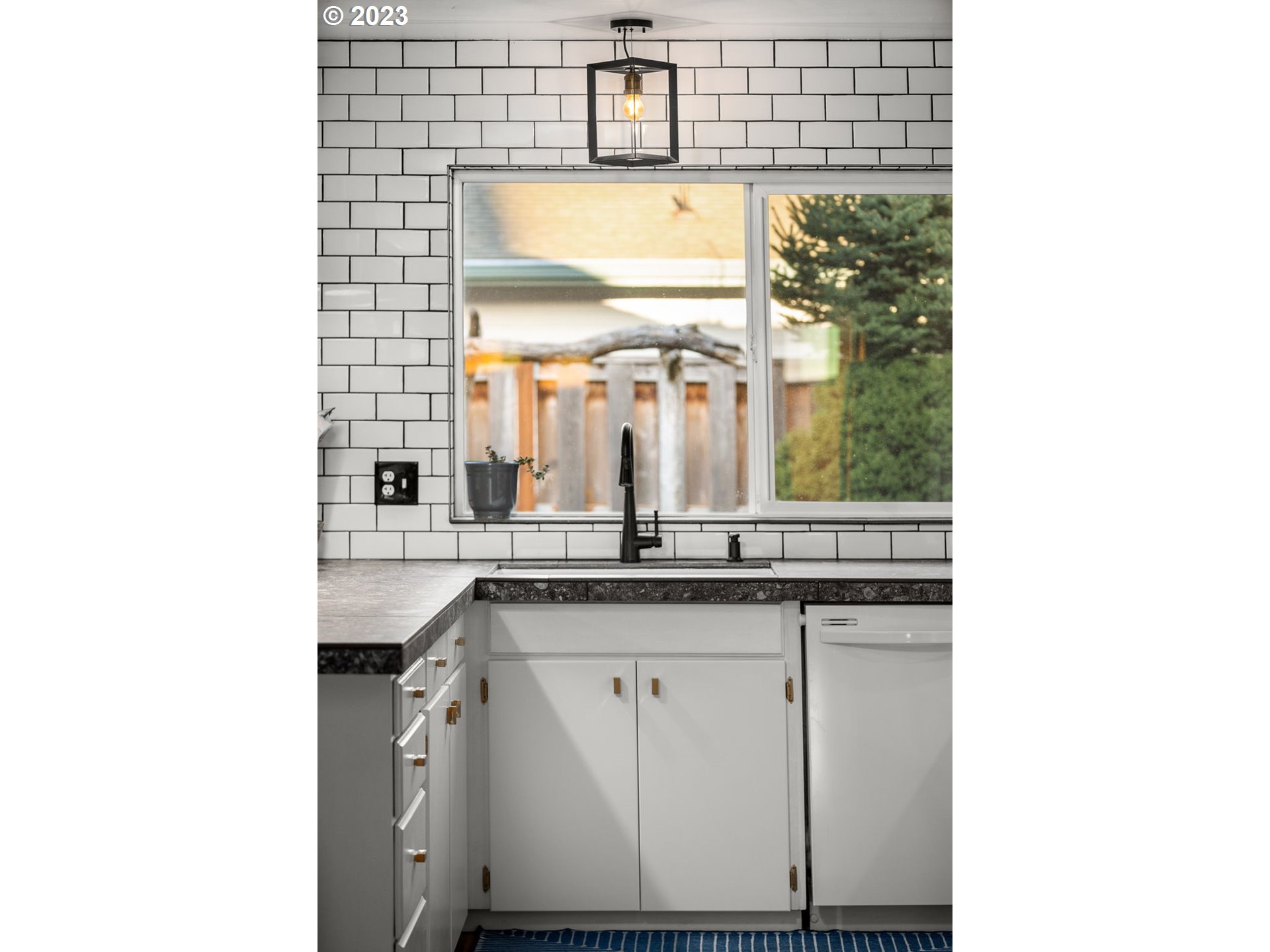 14155 Southwest Hart Road Beaverton, OR 97008 - Photo 17 of 30 a kitchen with a sink and a window
