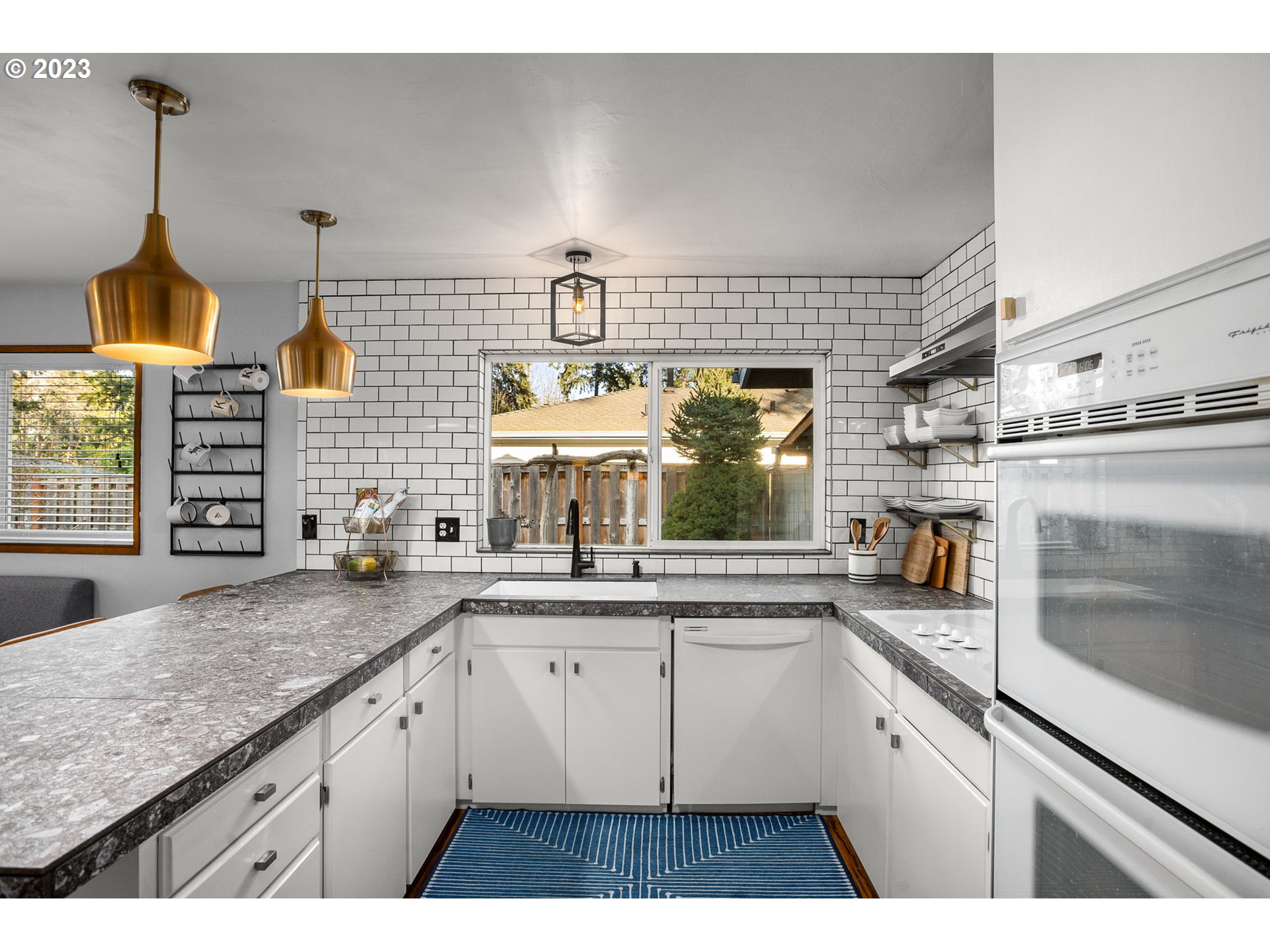 14155 Southwest Hart Road Beaverton, OR 97008 - Photo 18 of 30 a kitchen with a sink and cabinets