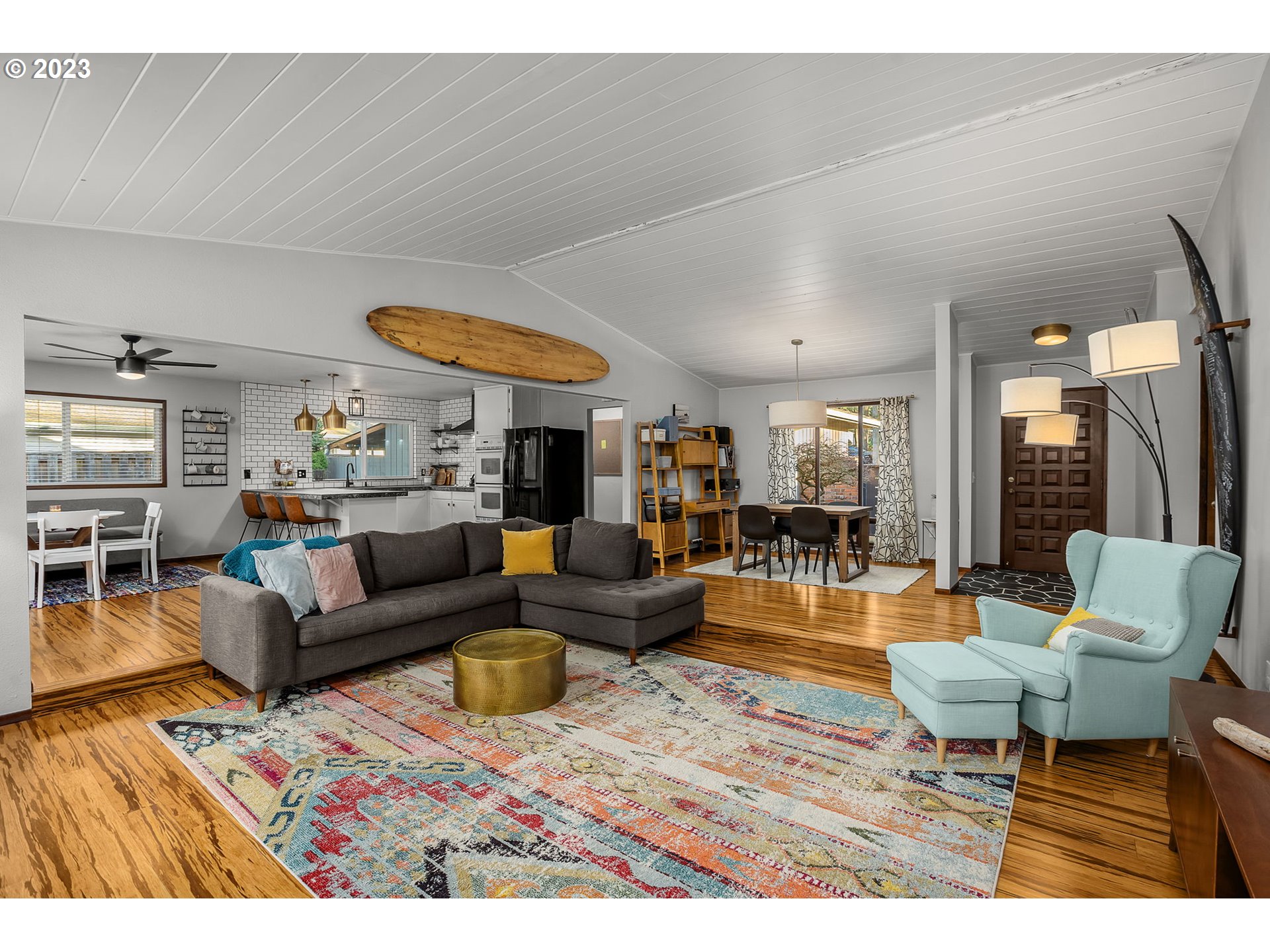 14155 Southwest Hart Road Beaverton, OR 97008 - Photo 2 of 30 a living room with furniture a rug and a large window