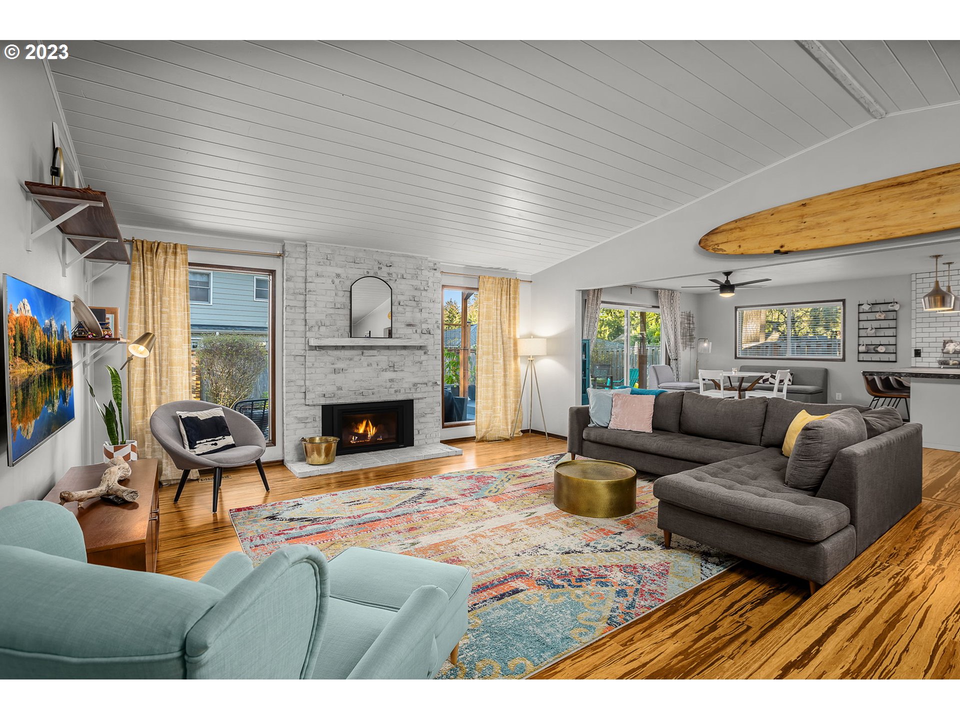 14155 Southwest Hart Road Beaverton, OR 97008 - Photo 3 of 30 a living room with furniture large window and a fireplace