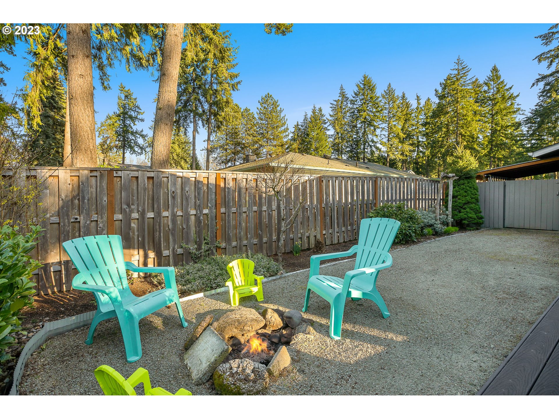 14155 Southwest Hart Road Beaverton, OR 97008 - Photo 7 of 30 a view of a chairs and table in the back yard of the house