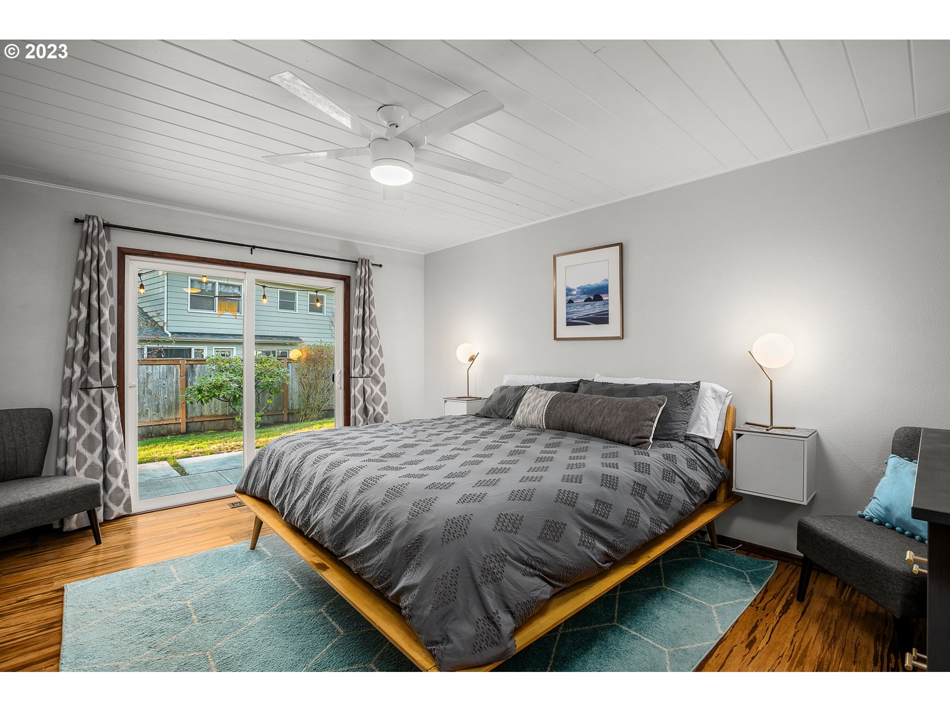 14155 Southwest Hart Road Beaverton, OR 97008 - Photo 10 of 30 a bedroom with a bed and a large window
