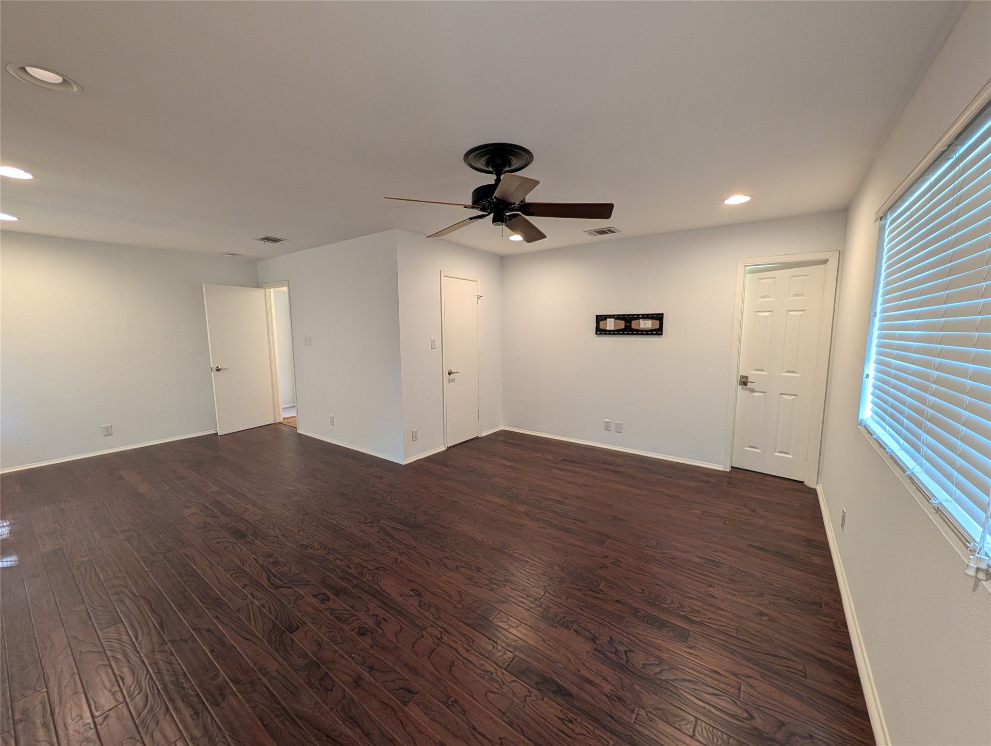 4601 Tamarack Trail Austin, TX 78727 - Photo 17 of 19 Rich hardwood floors complement a neutral palette, creating an inviting living space.