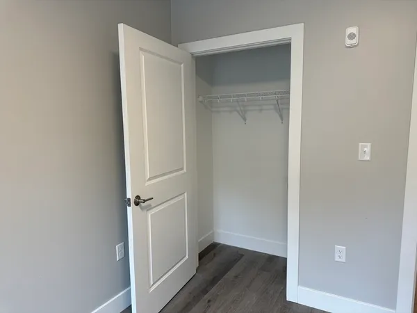 an empty room with wooden floor