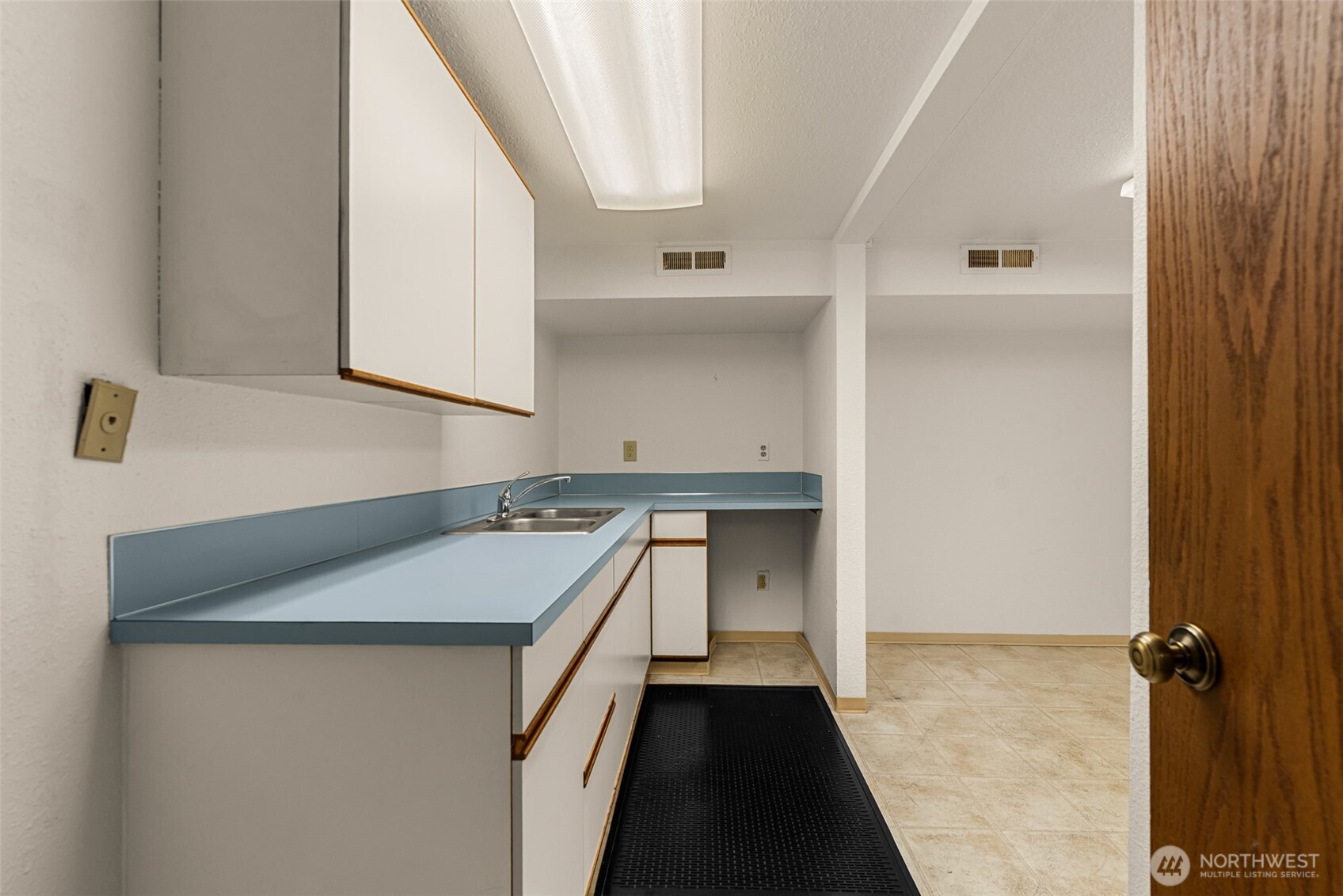 710 North Miller Street Wenatchee, WA 98801 - Photo 26 of 33 a utility room with cabinets and wooden floor