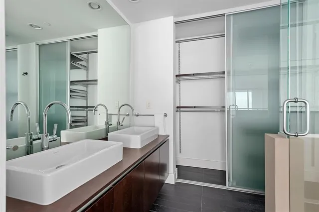 a kitchen with a sink and refrigerator