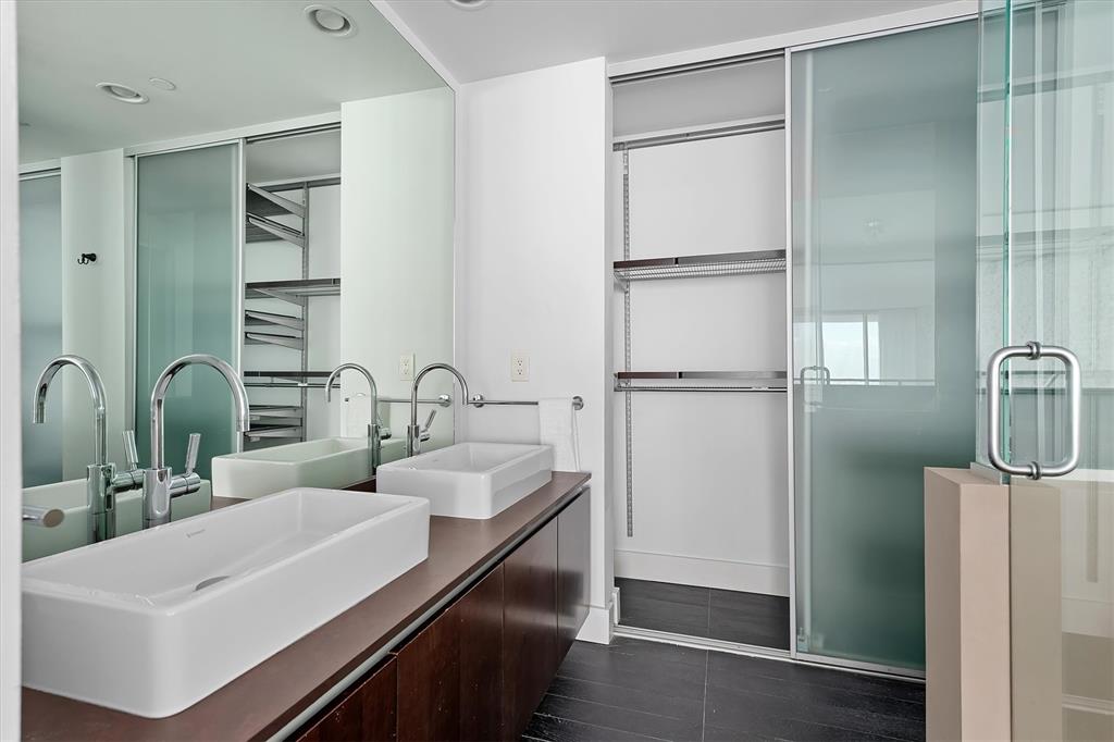 1040 Biscayne Boulevard, Unit 2101 Miami, FL 33132 - Photo 19 of 25 a kitchen with a sink and refrigerator