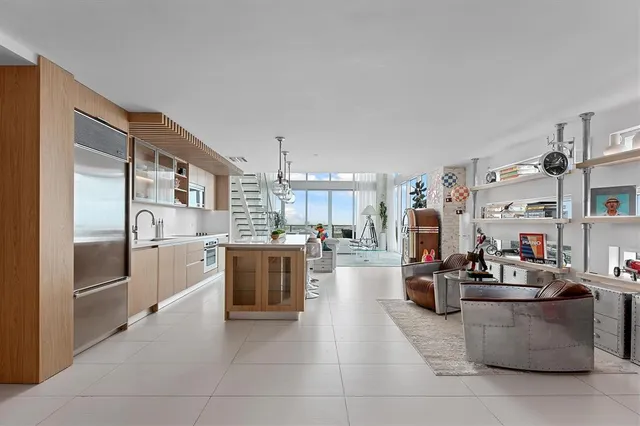 a kitchen with stainless steel appliances lots of counter top space