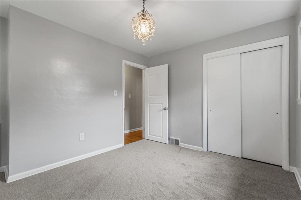108 W Road Pittsburgh, PA 15209 - Photo 24 of 50 a view of an empty room with a chandelier
