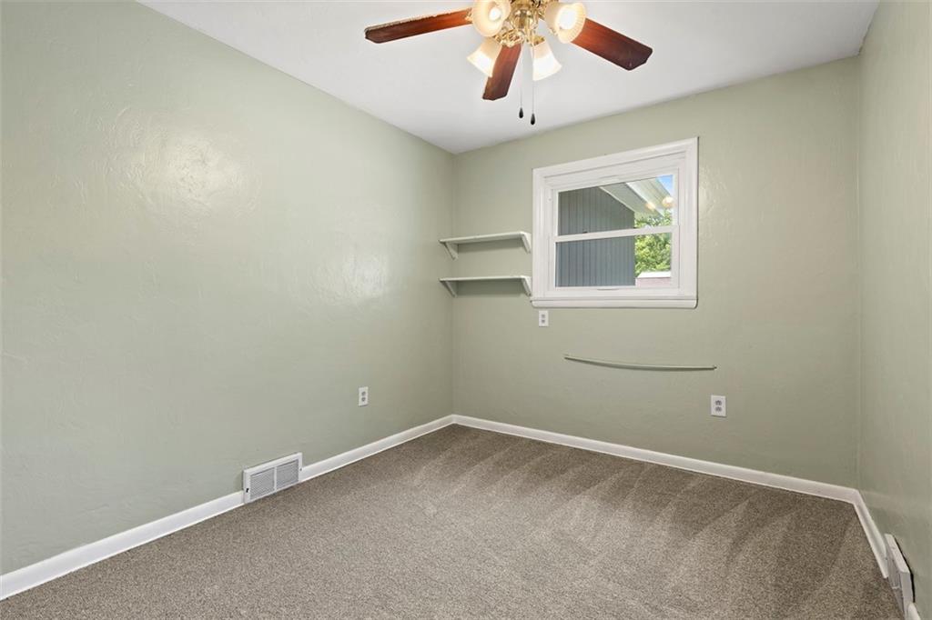 108 W Road Pittsburgh, PA 15209 - Photo 26 of 50 an empty room with a window and a fan