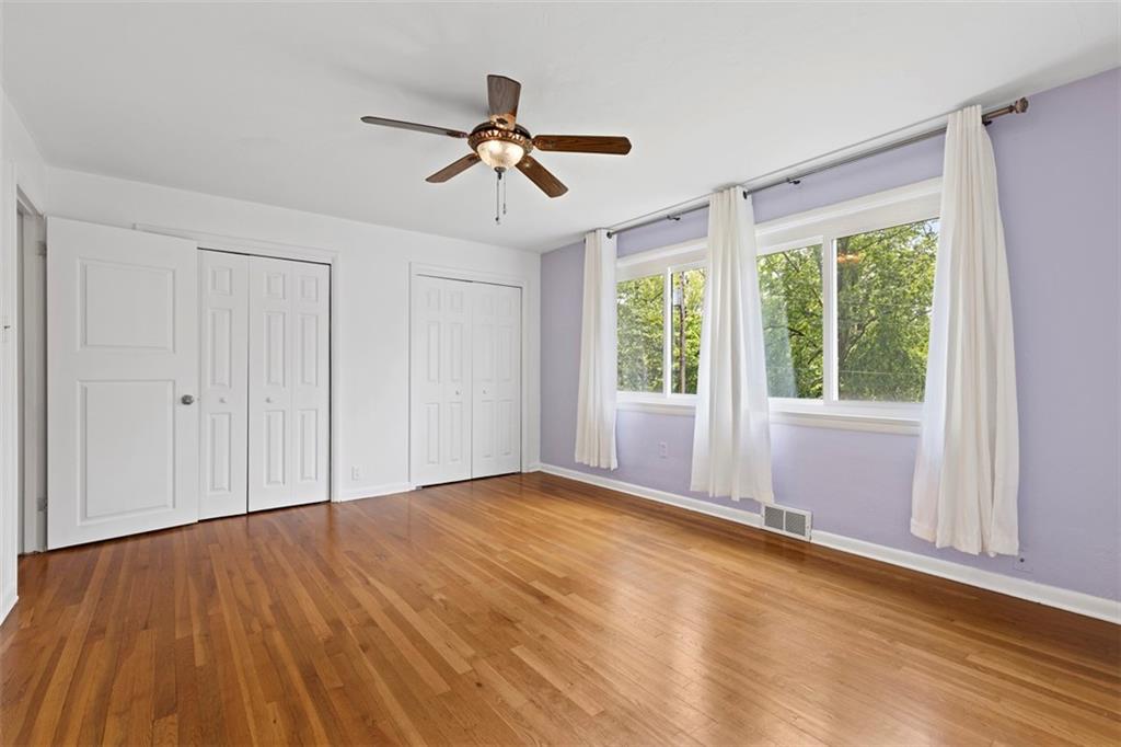 108 W Road Pittsburgh, PA 15209 - Photo 29 of 50 a view of empty room with wooden floor and fan