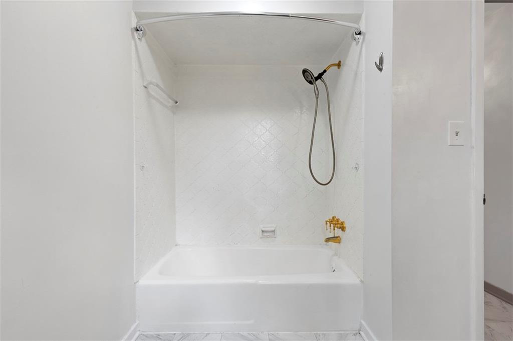 108 W Road Pittsburgh, PA 15209 - Photo 34 of 50 a bathroom with a bath tub with a shower