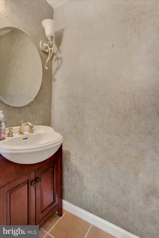 a spacious bathroom with a double vanity sink a mirror and a shower