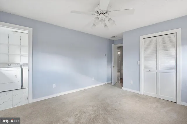 a room with pool table and windows