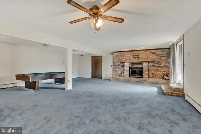 a patio with hardwood table and chairs