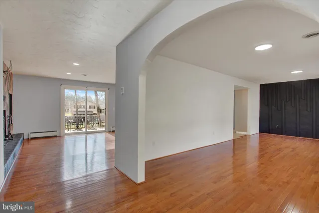 a view of a kitchen with wooden floor