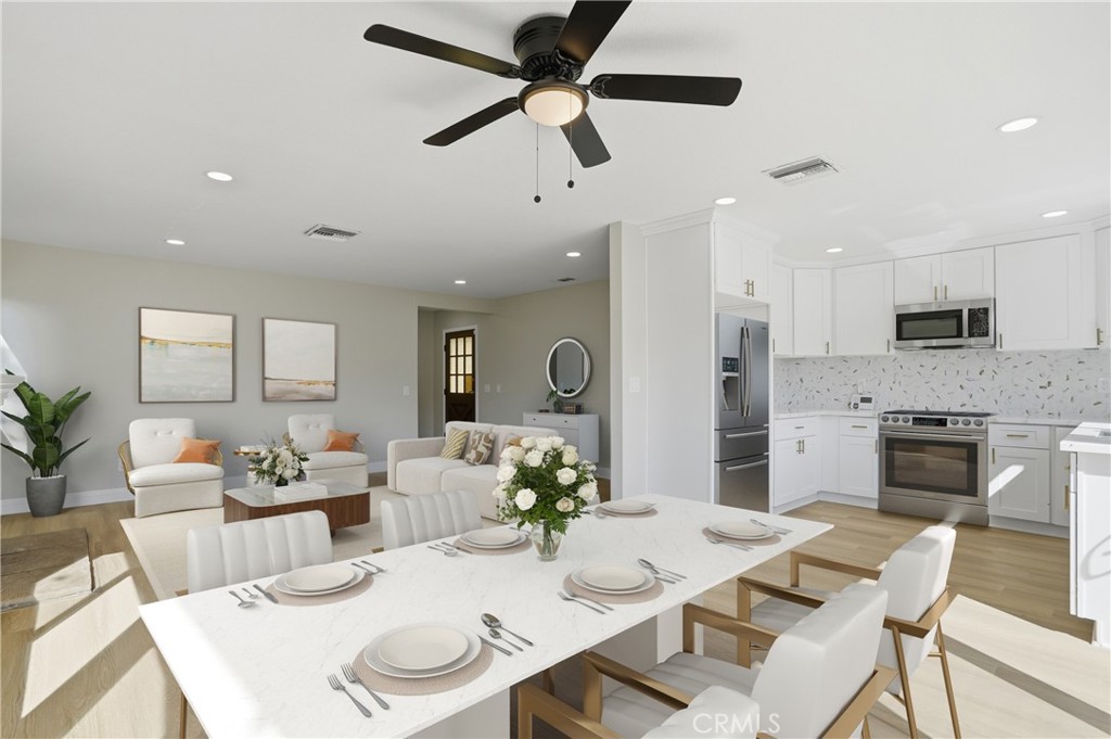 2924 Louisiana Place Riverside, CA 92506 - Photo 17 of 42 a view of a dining room with furniture and a kitchen