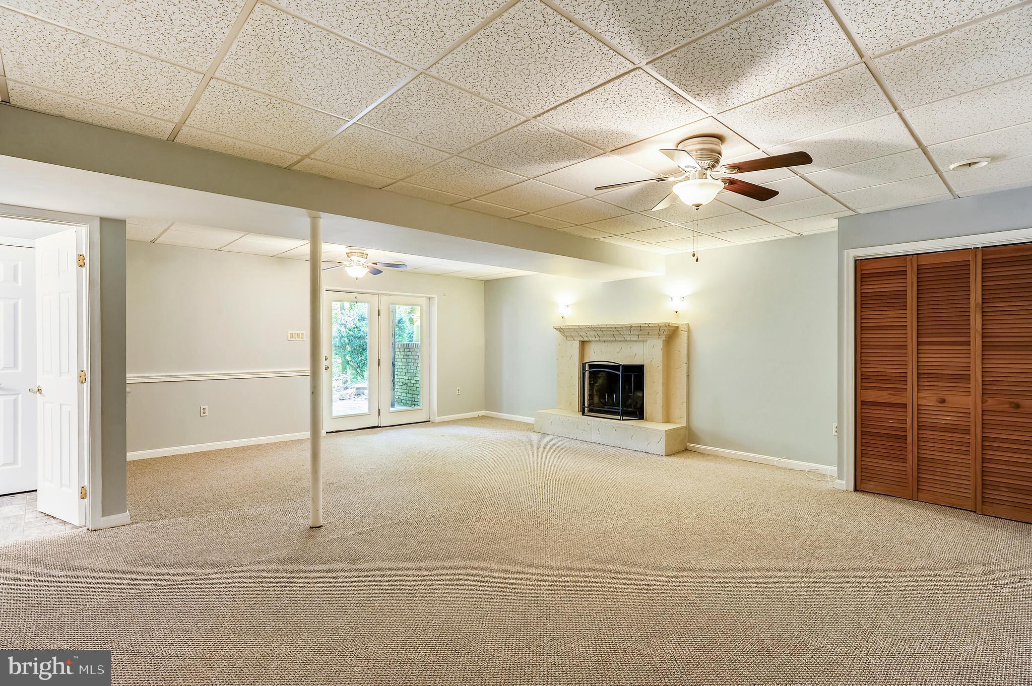 6755 Bensville Road Pomfret, MD 20675 - Photo 24 of 49 Lower lvl rec rm/in-law suite w/FP leads to patio
