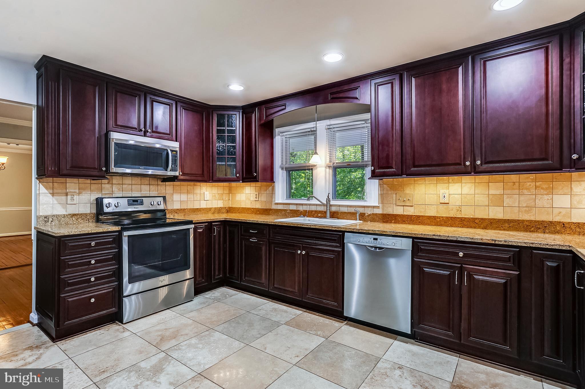 6755 Bensville Road Pomfret, MD 20675 - Photo 9 of 49 Cherry/Granite/Stainless/Travertine Kitchen