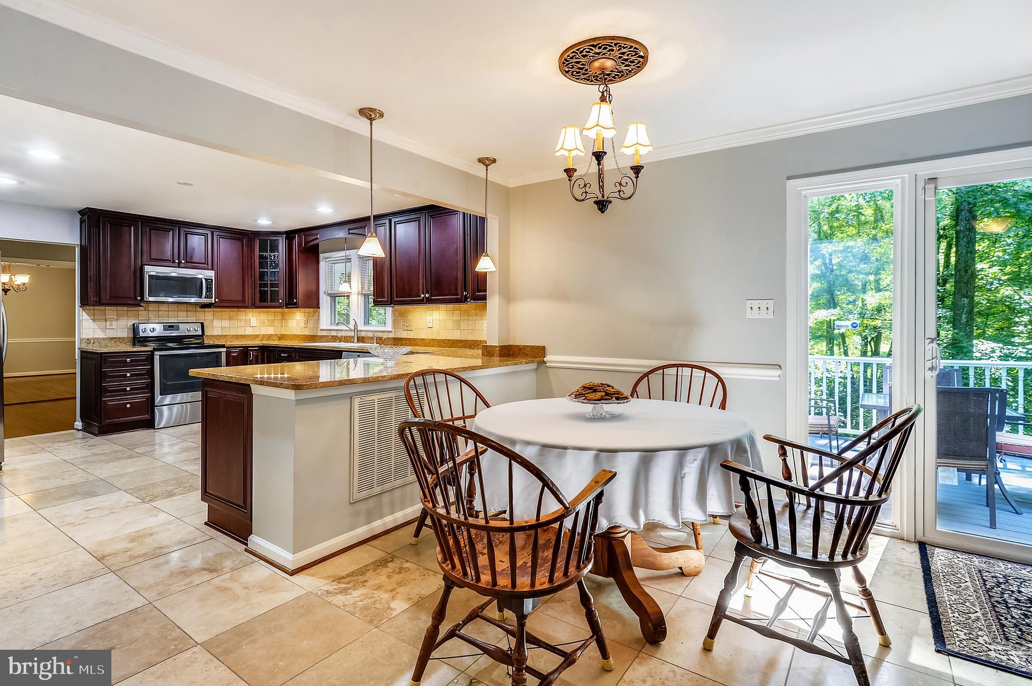 6755 Bensville Road Pomfret, MD 20675 - Photo 10 of 49 Table space kitchen leads to rear deck