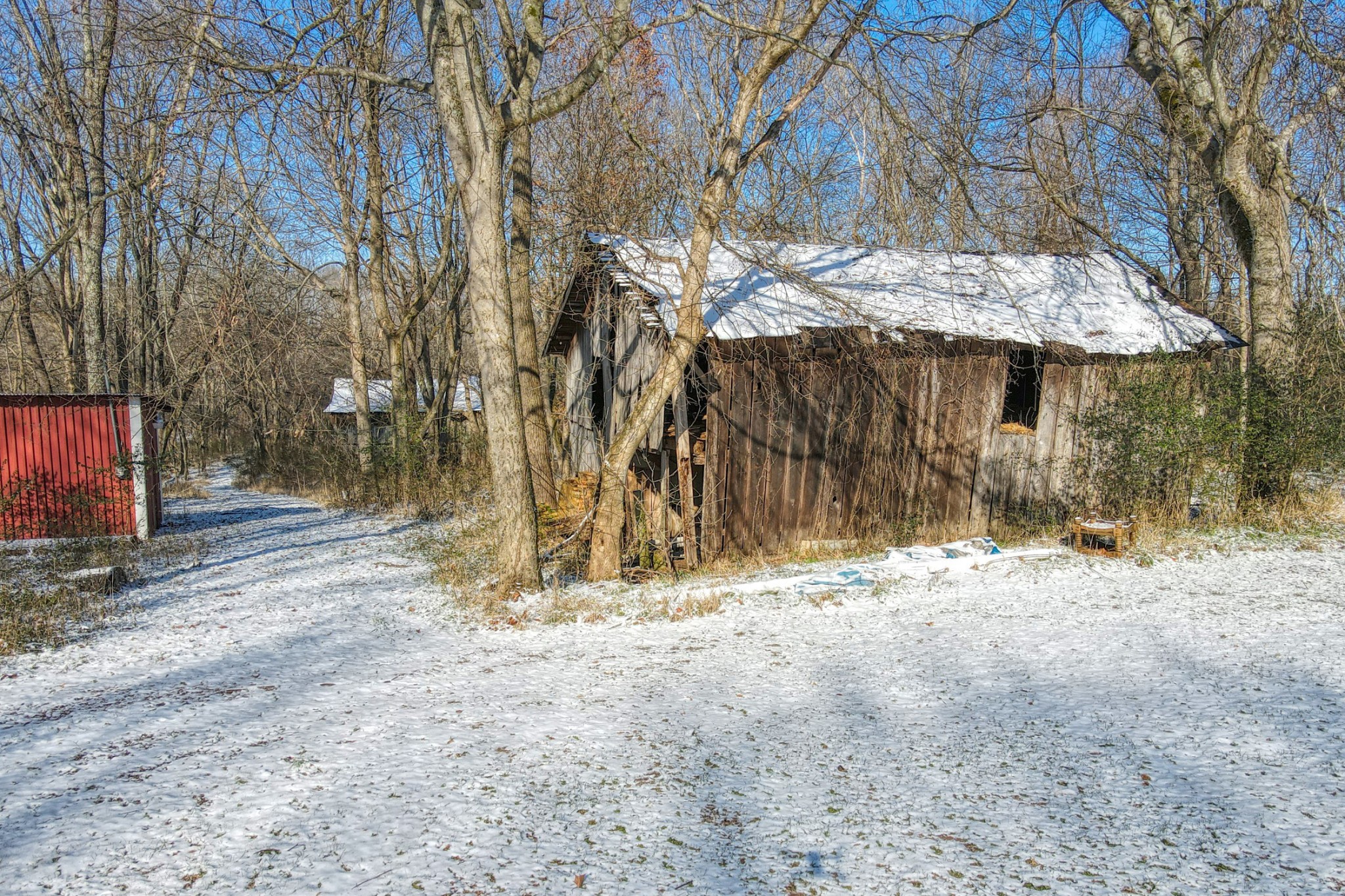 7707 Bob Carr Road Cross Plains, TN 37049 - Photo 13 of 49 a backyard of a house with table and chairs