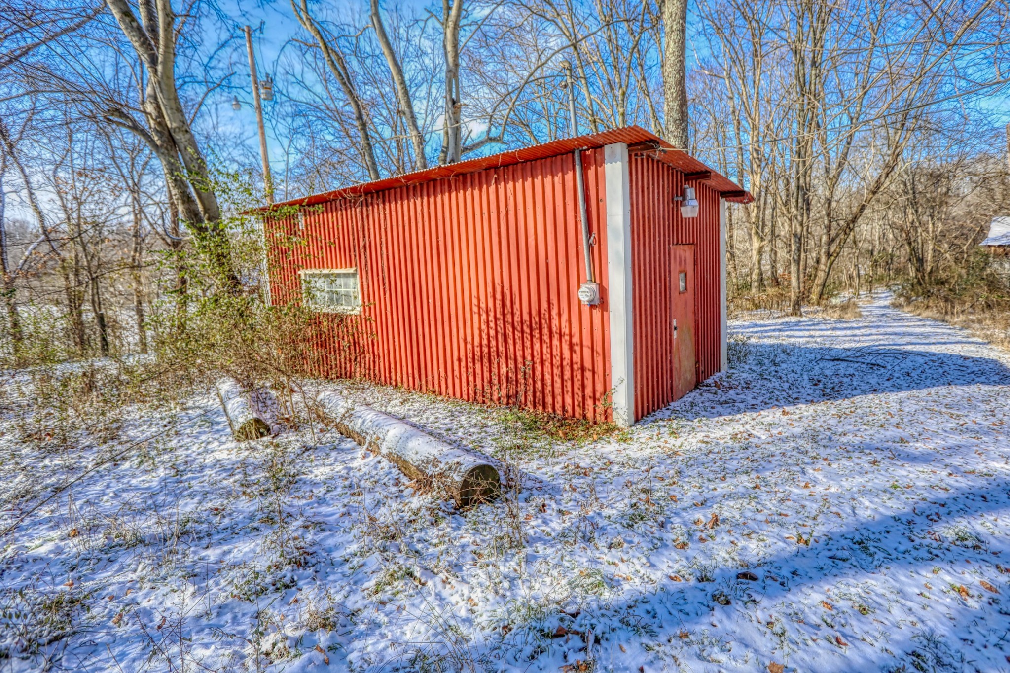 7707 Bob Carr Road Cross Plains, TN 37049 - Photo 17 of 49 a backyard of a house with a yard and garage