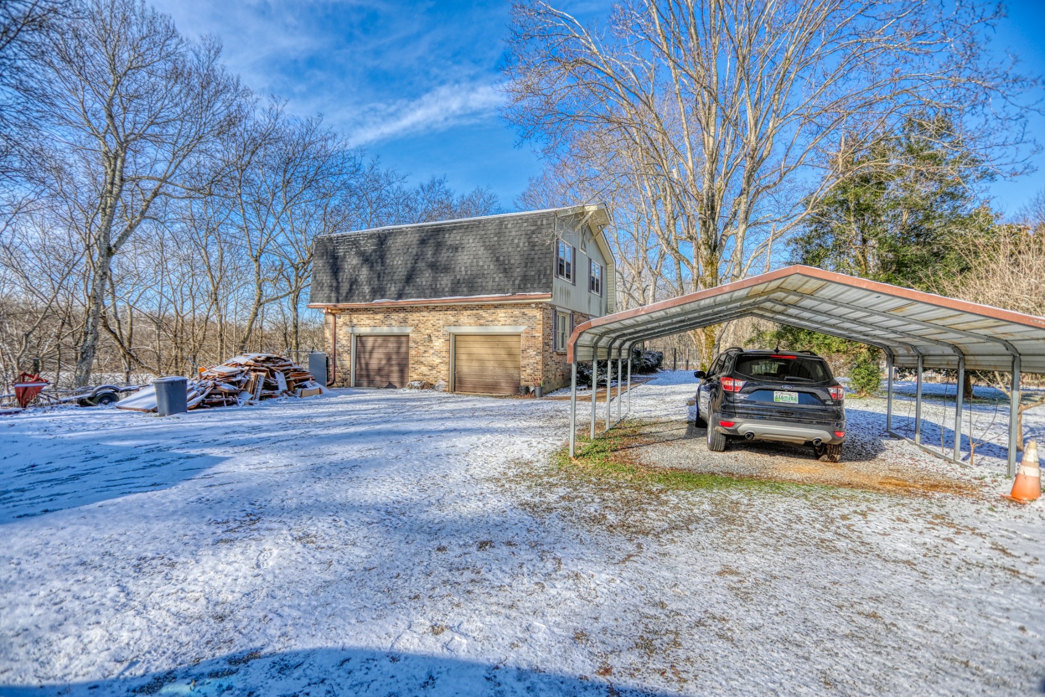 7707 Bob Carr Road Cross Plains, TN 37049 - Photo 4 of 49 a car parked in front of a house