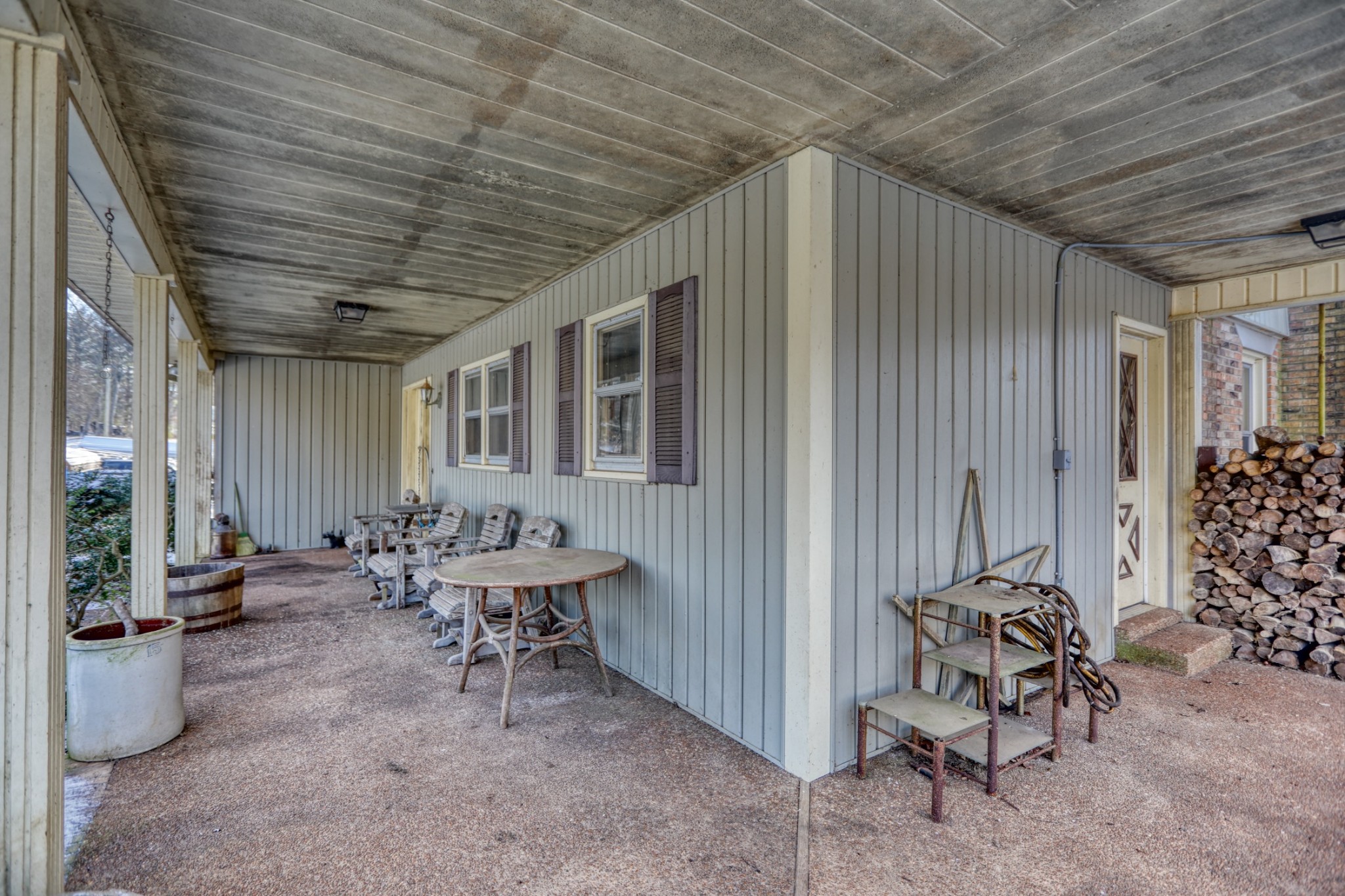 7707 Bob Carr Road Cross Plains, TN 37049 - Photo 46 of 49 a balcony with chairs and potted plants