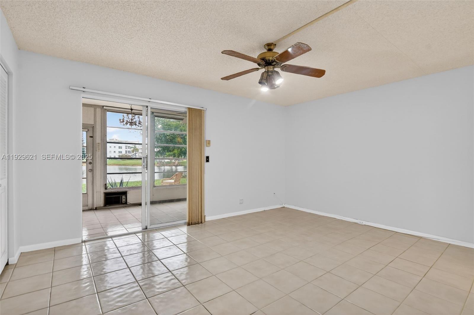 1008 Farnham North, Unit 1008 Deerfield Beach, FL 33442 - Photo 19 of 32 a view of an empty room and window