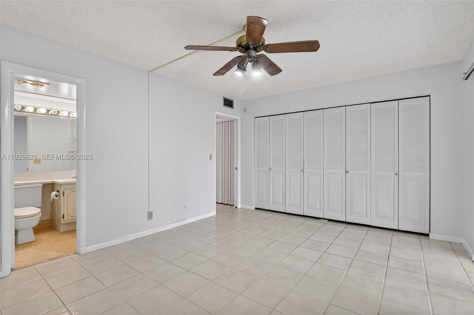 1008 Farnham North, Unit 1008 Deerfield Beach, FL 33442 - Photo 21 of 32 a view of an empty room and a bathroom