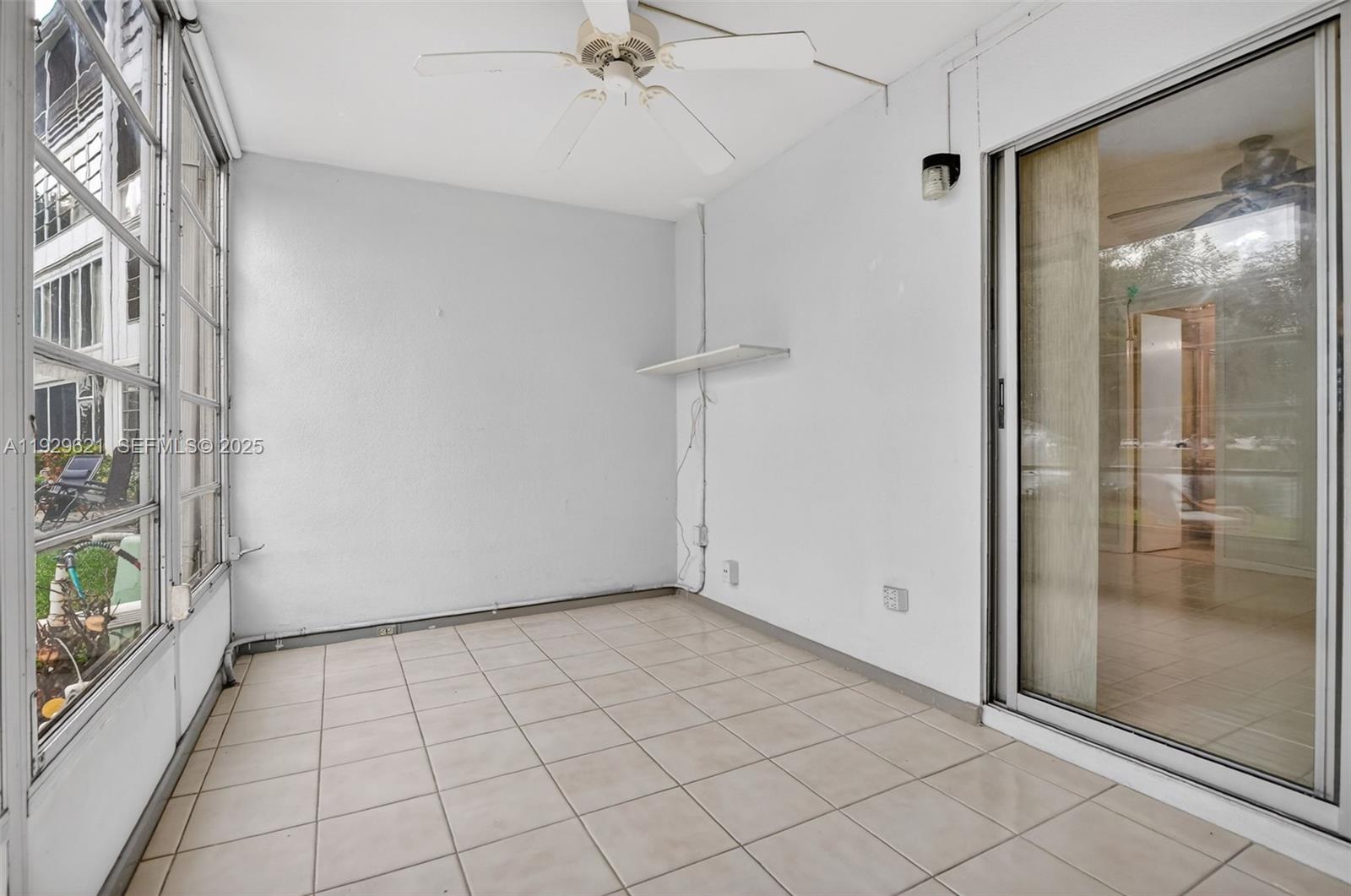 1008 Farnham North, Unit 1008 Deerfield Beach, FL 33442 - Photo 26 of 32 an empty room with windows
