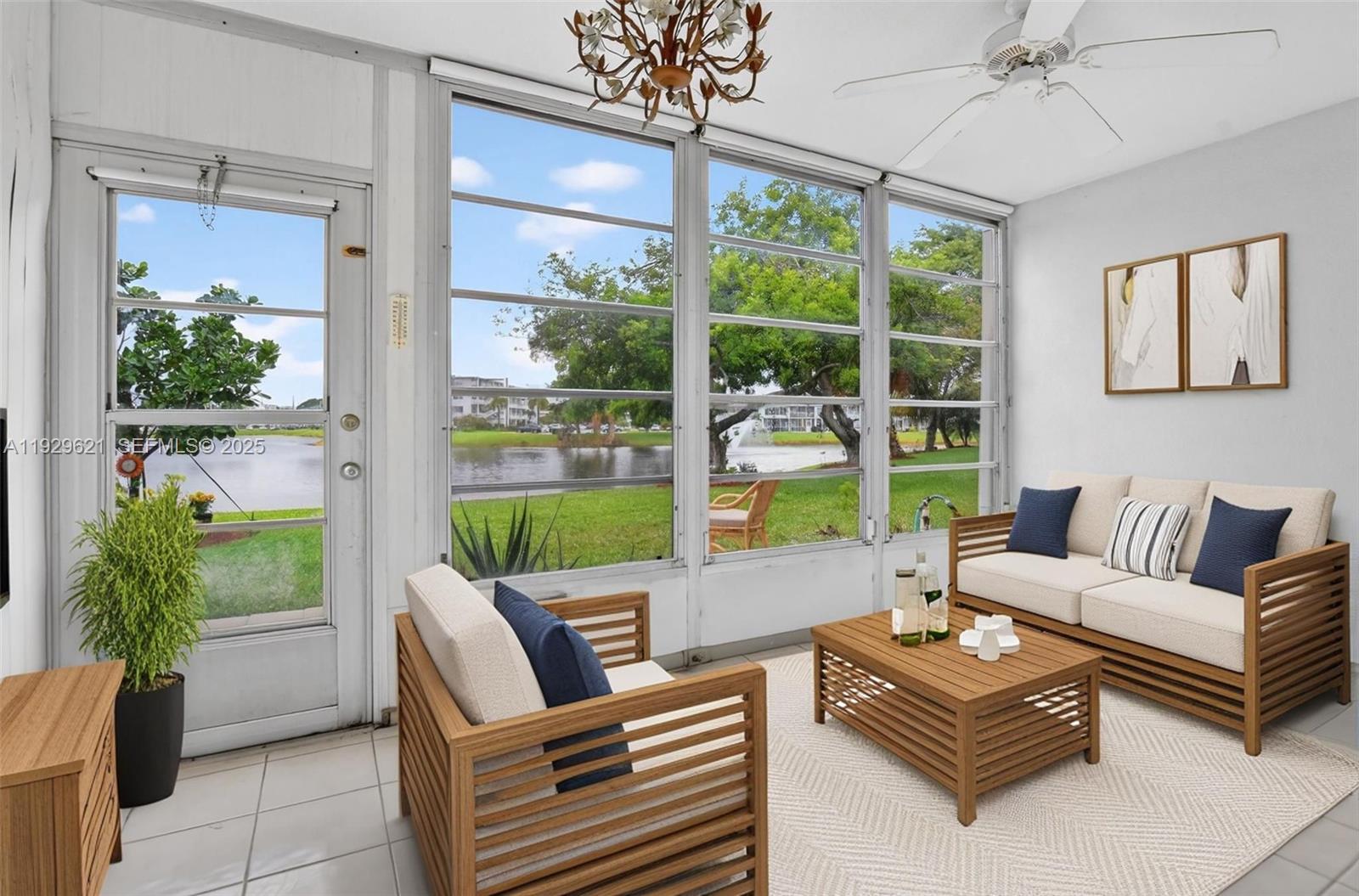 1008 Farnham North, Unit 1008 Deerfield Beach, FL 33442 - Photo 3 of 32 a living room with furniture and a potted plant