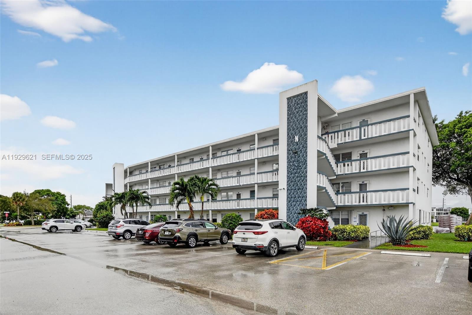 1008 Farnham North, Unit 1008 Deerfield Beach, FL 33442 - Photo 5 of 32 a car parked in front of a building