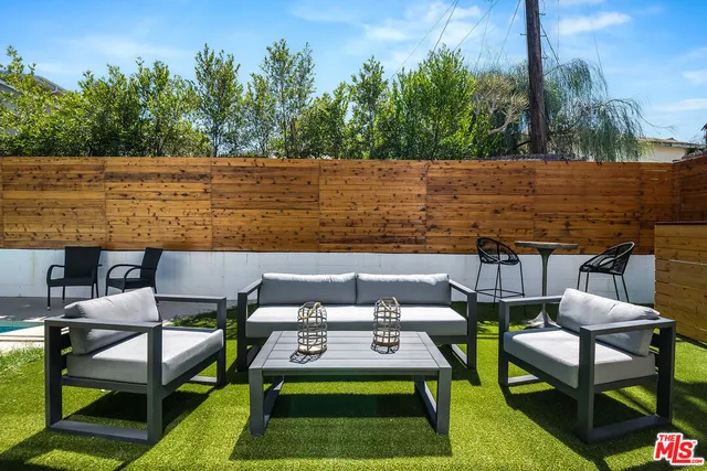 a view of a yard with furniture